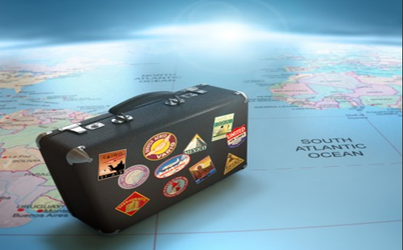 Traveling Suitcase sitting on a map
